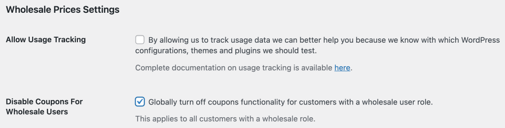 Turn off coupons for Wholesale Users in WooCommerce settings.